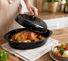 13" Oval Covered Roaster with Metal Grate - Black | Oven-Safe Non-Stick Bakeware