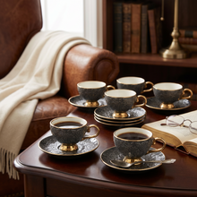 Black Embossed Cup and Saucer Set with Gold Trim