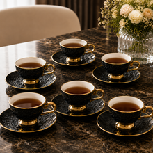 Black Embossed Cup and Saucer Set with Gold Trim