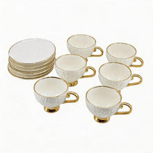 Decorative White Tea Cups and Matching Saucers