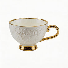 Decorative White Tea Cups and Matching Saucers