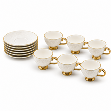 Decorative White Tea Cups and Matching Saucers