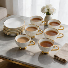 Decorative White Tea Cups and Matching Saucers