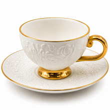 Decorative White Tea Cups and Matching Saucers