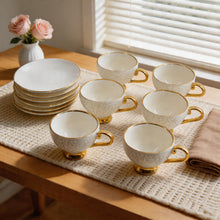 Decorative White Tea Cups and Matching Saucers