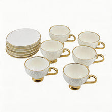 Decorative White Tea Cups and Matching Saucers