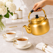 3L Golden Tea Kettle with Black Grip Handle and Fitted Lid