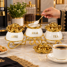 Luxury 3-Piece White & Gold Coffee, Sugar & Tea Canister Set with Floral Lids & Decorative Metal Stand