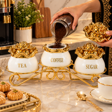Luxury 3-Piece White & Gold Coffee, Sugar & Tea Canister Set with Floral Lids & Decorative Metal Stand