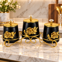 3-Piece Black & Gold Floral Kitchen Canister Set with Decorative Metal Stand & Crystal-Style Lid Knobs